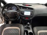 the interior of a car with a steering wheel, dashboard, and dashboard controls