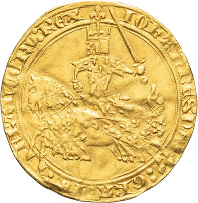 a close up of a gold coin with an image of a man on a horse