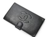 a black leather wallet with a logo on the front