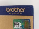 the back side of a brown and blue package with a qr code on it