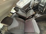 the interior of a car with a bunch of seats and a steering wheel