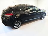 a picture of a black car in a white room