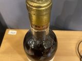 a bottle of wine that is sitting on a table