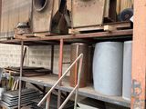 many stacks of metal items on the shelves in the warehouse