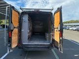 the back of a van with its doors open in a parking lot