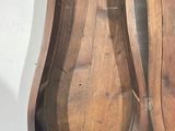 a wooden grandfather clock that is on display in a room