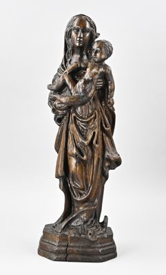 an image of a statue of a woman holding a child