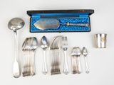 a silverware set with a spoon, spoon, and spoon rest