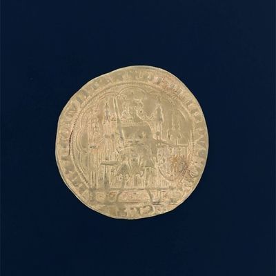 an image of a gold coin with a picture of a man on it