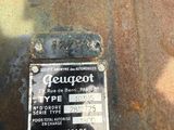a sign on the side of a rusted vehicle