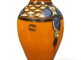 an orange vase with a blue and yellow design on it