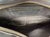 the inside of a black purse with a zipper on it