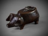 an image of a wooden pig with a ring on it ' s nose