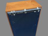 a small blue refrigerator with a wooden top on a gray background