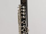 a close up of a clarinet with a string attached to it
