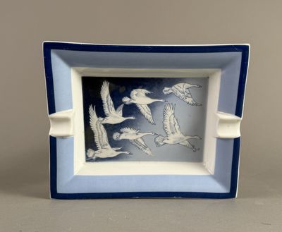 a picture of a blue and white plate with birds on it