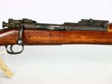 a close up of a rifle on a white background with a price tag