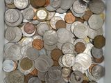 a white box filled with lots of silver and gold coins