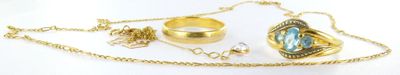 a necklace with a ring, a ring, a ring, and a ring on it