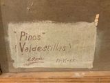 a sign that says pinos valdestillas on the side of a building
