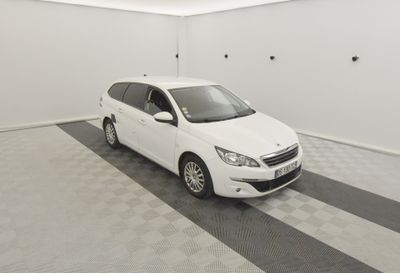 a picture of a white car parked in a garage