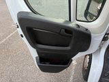 a close up of the door handle of a white truck