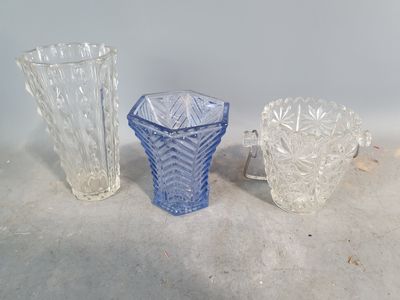 three glass vases sitting next to each other on a table