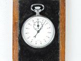 a small wooden box with a clock inside of it