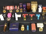 a lot of different perfumes and perfume bottles on a table