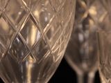 several empty wine glasses are lined up on a table