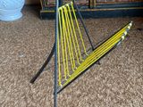 a yellow hammock on a stand in a living room