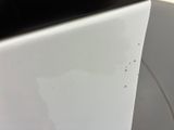 a close up of a white toilet with a black lid