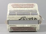 a white accordion sitting on top of a table