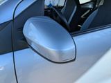 a close up of a car ' s side mirror with the door open