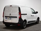 the back end of a white van parked in a white room