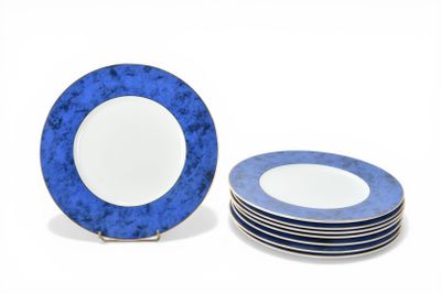 several blue and white plates are stacked on top of each other