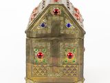 brass box with red, green, and blue stones on top