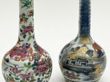 pair of chinese vases on a white background with flowers and birds