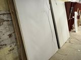 two large white boards sitting in the middle of a room