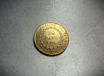 a close up of a gold coin on a table