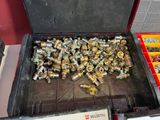a box full of nuts and bolts on a table