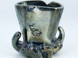 an image of a silver vase with a dragon on it