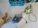 a person standing next to a bunch of tools on the floor