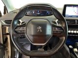 the interior of a car with a steering wheel and dashboard controls