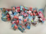 a white box filled with lots of pink and blue candies