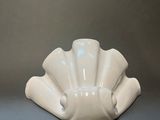 an image of a white vase on a table