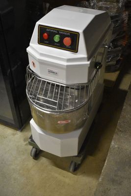 a mixer that is sitting on a cart in a room