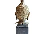 an image of a statue of a bird sitting on a block