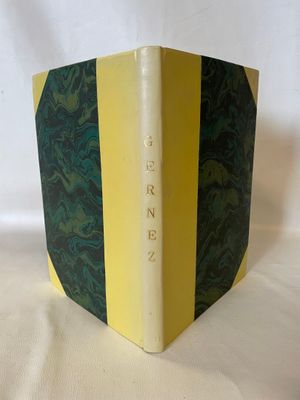 yellow and green book with a black and white stripe on the cover