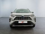 the front of a silver toyota rav parked in a white room